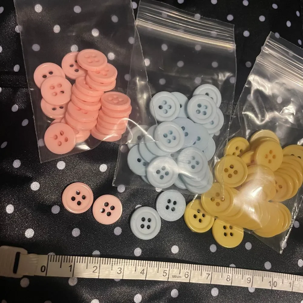 Vintage lot plastic four hole pastel‎ pink blue yellow clothing flat buttons